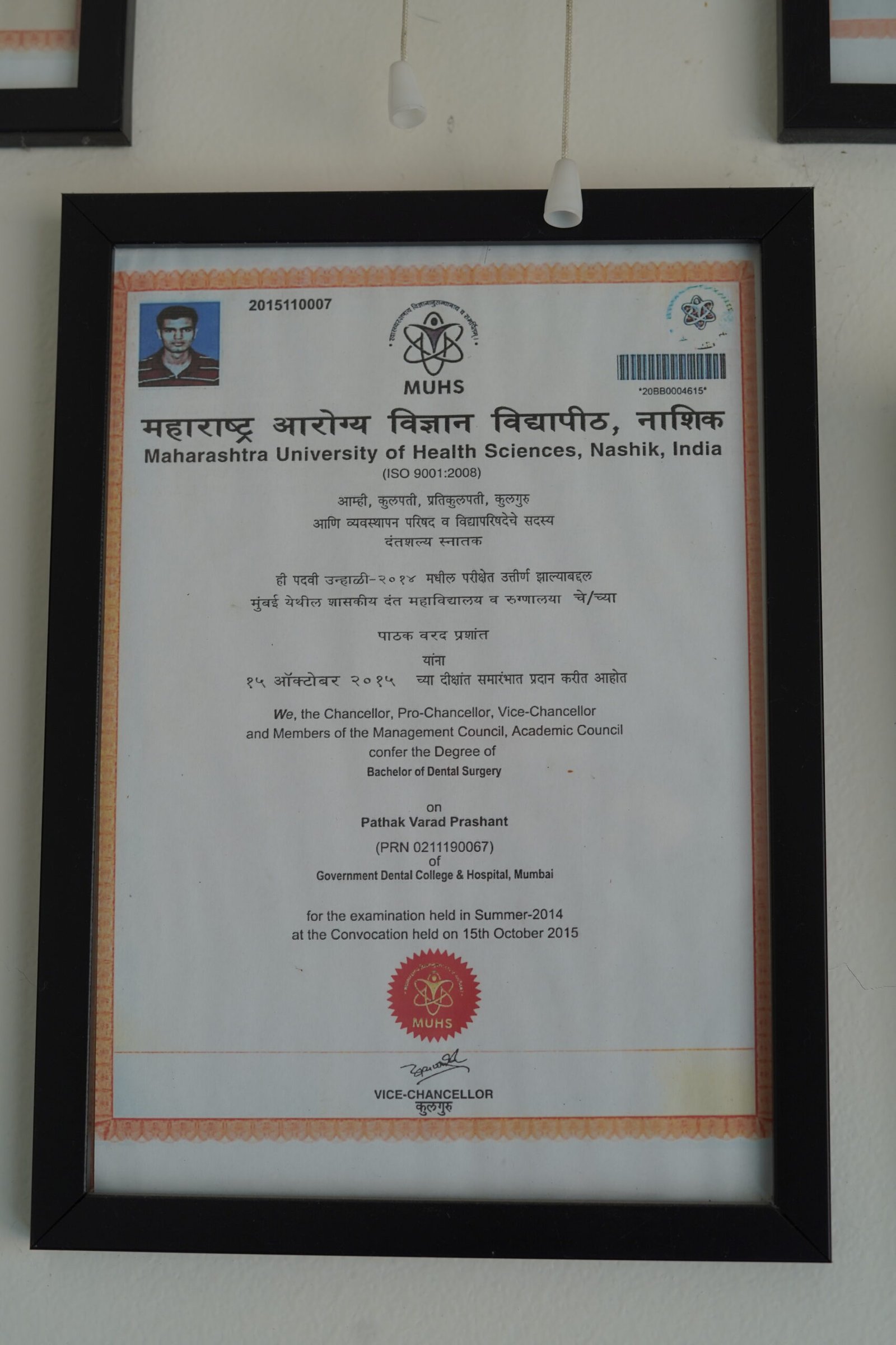 Dr Varad Pathak BDS degree certificate at Curo Dental Clinic in Ravet Pune