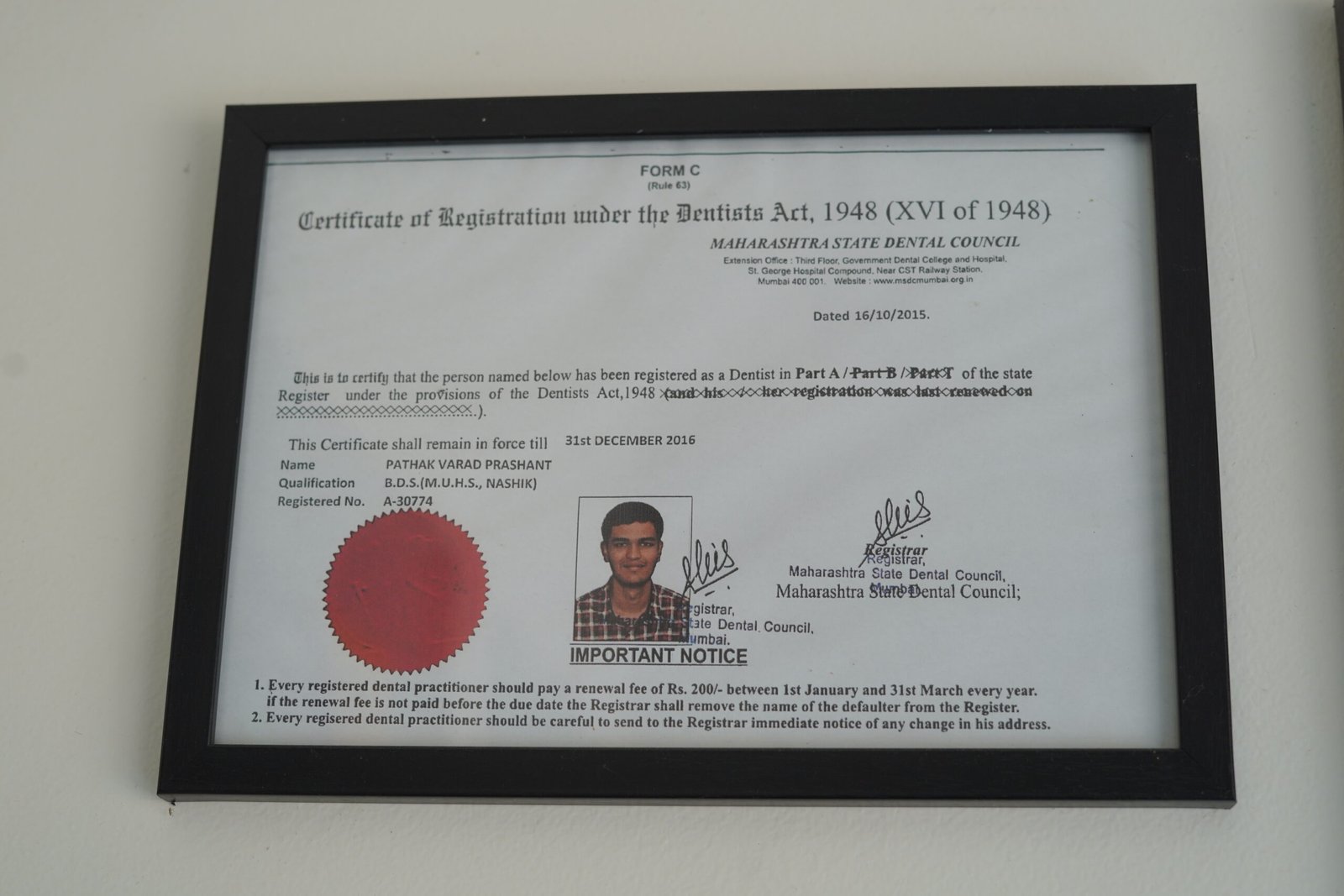 Dr Varad Pathak dental council registration certificate at Curo Dental Clinic in Ravet Pune